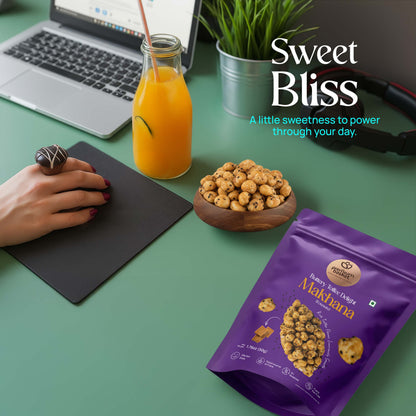 Purple makhana snack pouch on table with wooden bowl of roasted makhana