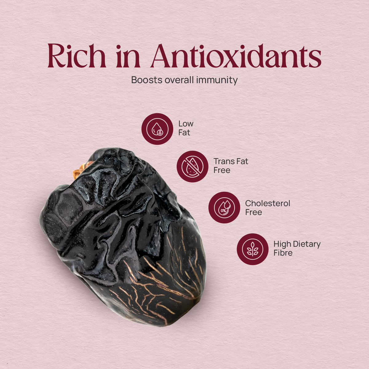 Dark Ajwa date fruit, glossy wrinkled surface