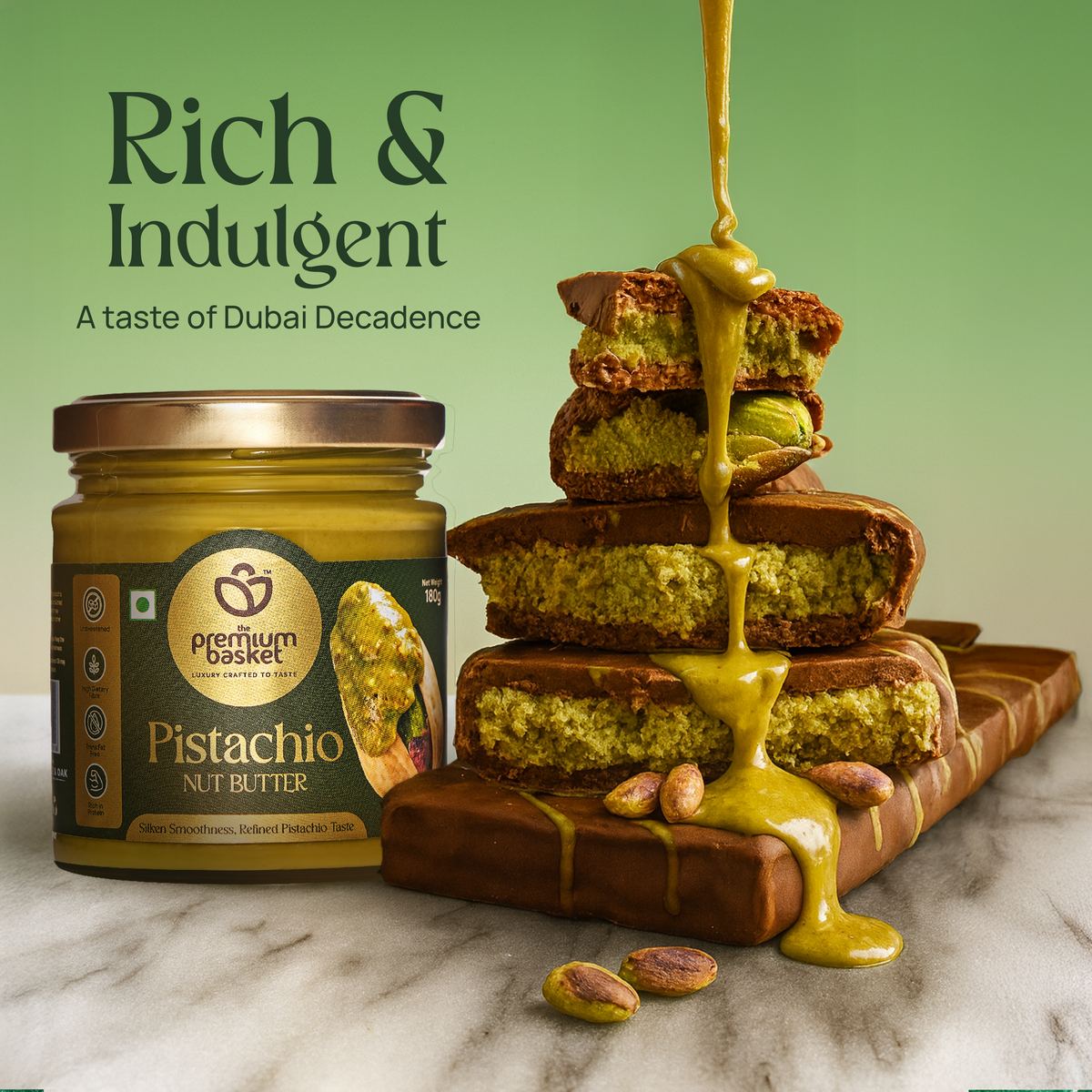 Pistachio nut butter jar with pistachio drizzle on stacked dessert slices