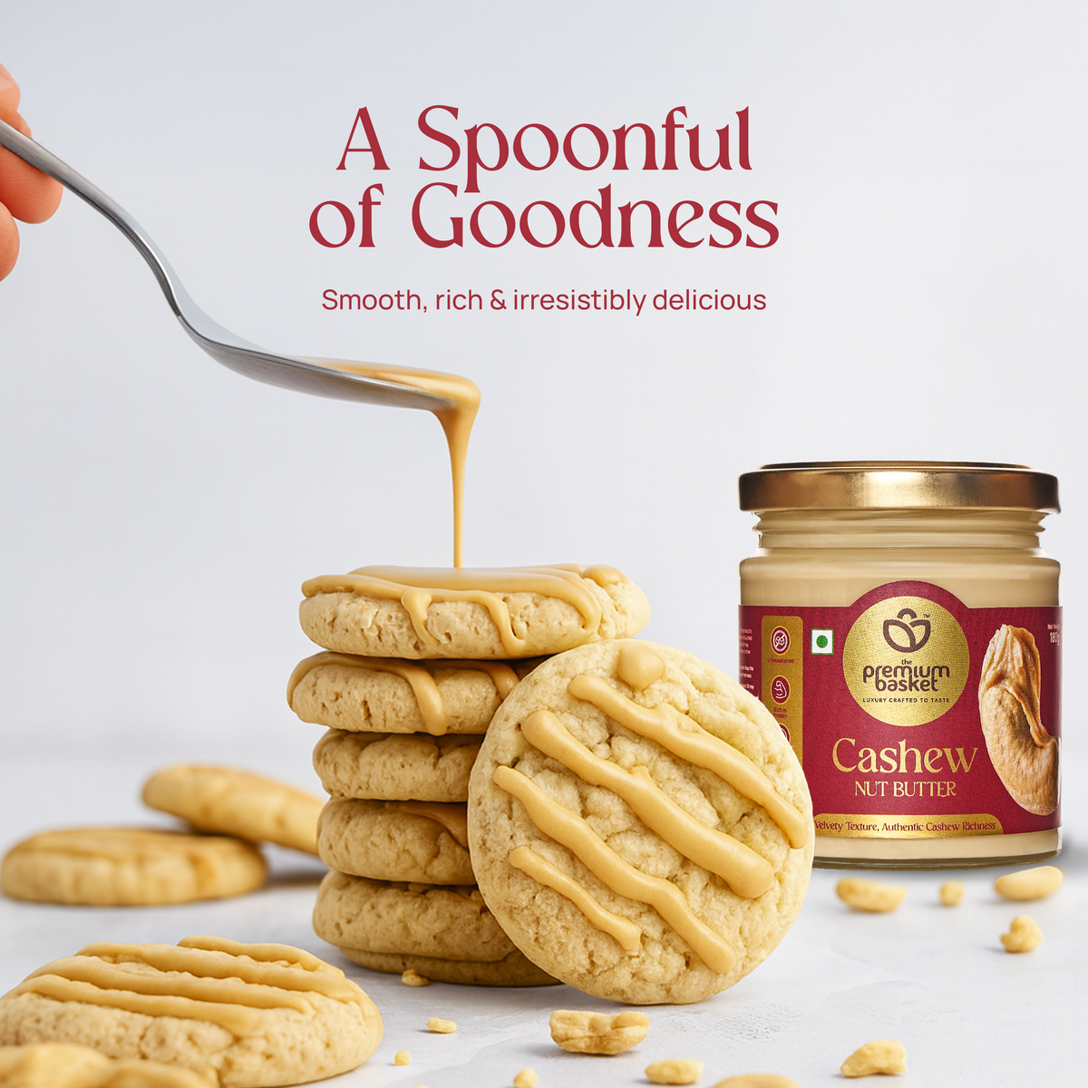 Cashew nut butter jar beside cookies with creamy drizzle