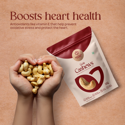 Goa Cashews pouch next to a handful of cashew nuts