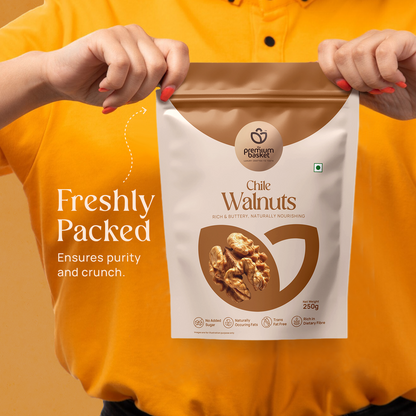 Chile Walnuts 250g pouch held in front of a person