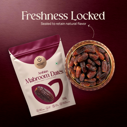 Arabian Mabroom Dates pouch beside a bowl of dark dates