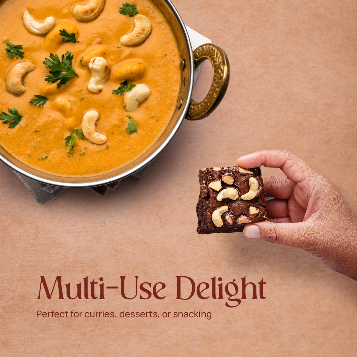 Cashew nuts in a bowl and a hand holding a cashew snack