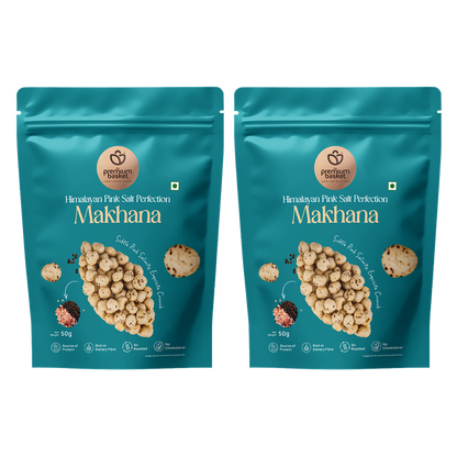 Two turquoise makhana snack pouches, front view with puffed lotus seed graphics