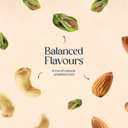 Mixed nuts assortment with cashews and pistachios scattered on a light background